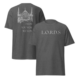 May include: Two heather grey t-shirts with a white graphic print. The front of one shirt says "L.O.R.D.S." and the back of the other shirt has a drawing of a church with the text "I Vow You Vow We Vow".