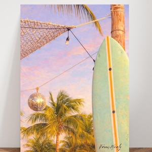 May include: A vertical print featuring a light green surfboard with orange stripes, a disco ball, and palm trees. The background shows a sunset with pink and purple hues. The text "From Marly" is visible on the surfboard.