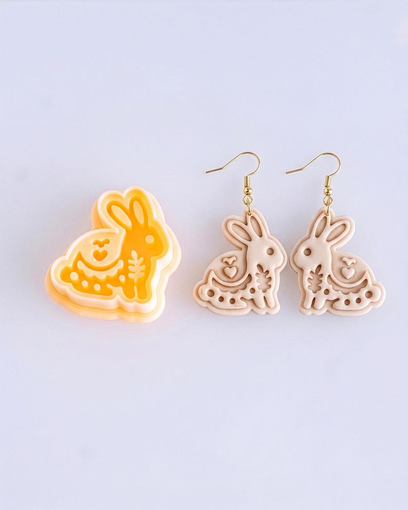 Scandi folk bunny polymer clay cutter with mirrored earring pair in soft off white, showing clean and consistent details