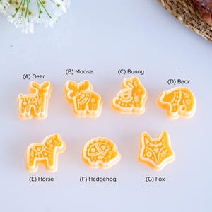 Full scandi folk animal clay cutter set with 7 labeled designs including deer, moose, bunny, bear, horse, hedgehog and fox