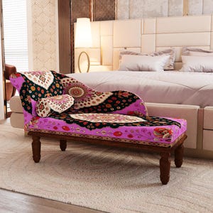 a bedroom with a large bed and a colorful, patterned chair in the foreground.