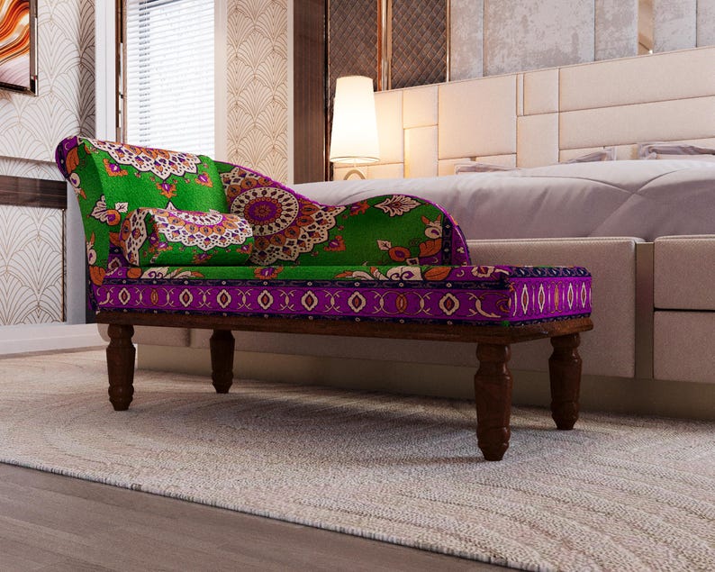 a colorful, patterned bench with a green and purple cushion, placed in a bedroom setting with a white headboard and a rug on the floor.