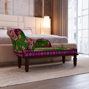 a modern bedroom with a large bed, a colorful patterned armchair, and a large window with curtains.