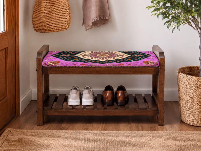 A wooden bench with a colorful patterned seat, displaying a pair of shoes on the lower shelf, and a woven basket next to it.