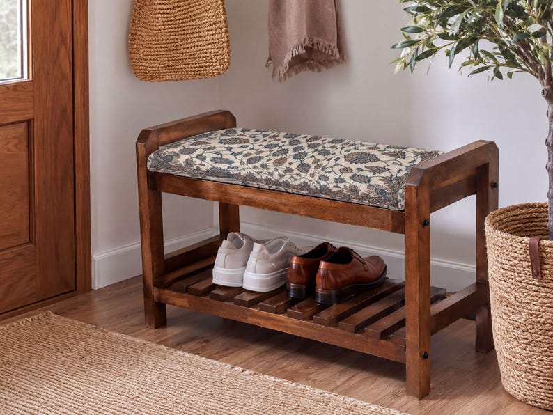 A wooden bench with a woven seat and storage space underneath, placed in a hallway with a woven basket and a potted plant nearby.