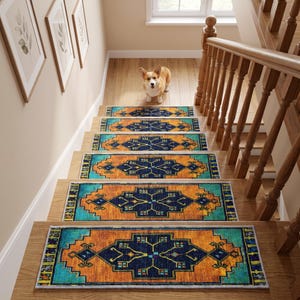 May include: A set of rectangular stair treads featuring a vibrant geometric pattern in shades of deep blue, bright orange, and turquoise. Each tread has a central dark blue diamond motif with intricate detailing, bordered by orange and turquoise.