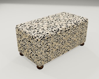 May include: A black and white patterned storage ottoman with wooden legs. The ottoman is made of fabric and has a rectangular shape.