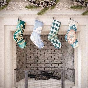 May include: Four Christmas stockings hang above a fireplace. The stockings have various patterns, including a teal and gold damask, a blue sky with clouds, a green and white houndstooth, and a red and blue geometric design. Pinecones and greenery decorate the mantel.