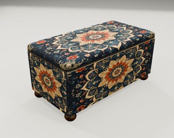 May include: A rectangular ottoman with a dark blue floral pattern. The design features a large, central medallion in shades of orange, beige, and teal, surrounded by smaller floral motifs. The ottoman rests on four small, dark wooden legs.