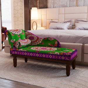 a bedroom with a large bed and a colorful, patterned bench or ottoman in the foreground.
