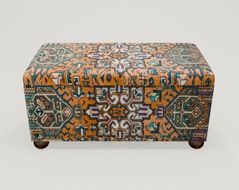 May include: A rectangular storage ottoman with a colorful patterned fabric top. The fabric features a geometric design in shades of orange, blue, green, and white.