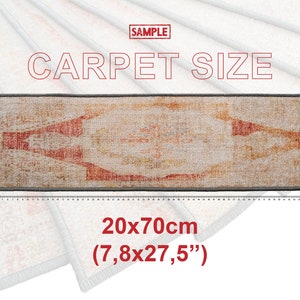 May include: A beige and red patterned rug with a gray border. The rug is 20 inches by 70 inches (7.8 inches by 27.5 inches).