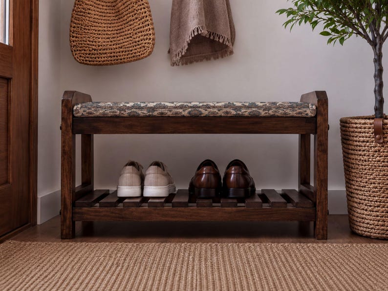 A wooden bench with a woven seat and storage space underneath, displaying a pair of shoes on the lower shelf.