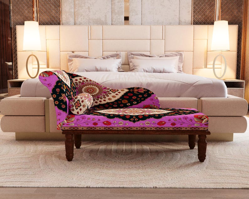 a luxurious bedroom with a large bed, a colorful patterned armchair, and two floor lamps on either side of the bed.