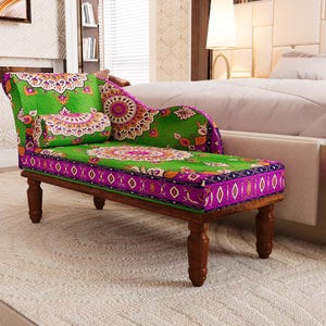 a vibrant, colorful, and intricately patterned armchair with a green and purple design, placed in a bedroom setting.