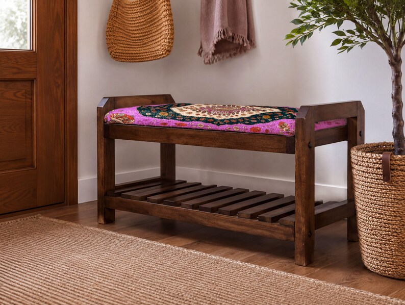 a wooden bench with a colorful, patterned seat, placed in a room with a woven basket and a potted plant.