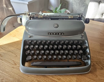 A wonderful 1957 Alpina SK24 Typewriter in perfect working condition! Fully serviced and ready to type! Mid-century design at its finest!