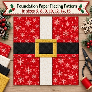 May include: A foundation paper piecing pattern featuring a red fabric block with white snowflake prints, a vertical white strip, and a horizontal black belt with a gold buckle. The text reads: Foundation Paper Piecing Pattern in sizes 6, 8, 9, 10, 12, 14, 15.