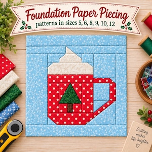 May include: A foundation paper piecing quilt block featuring a red mug with white polka dots and a green Christmas tree design. The mug is topped with white whipped cream and set against a light blue background with white floral patterns.