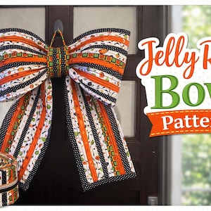 May include: A large, decorative bow made from fabric strips in orange, black, and white patterns, hanging on a door. A roll of matching fabric strips sits below the bow. The text "Jelly Roll Bow Pattern" is displayed on the right.