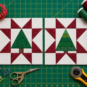 May include: Two square quilt blocks featuring a central green Christmas tree design surrounded by a red and white star pattern. The blocks are arranged on a green cutting mat with sewing supplies including thread spools, scissors, and clips.