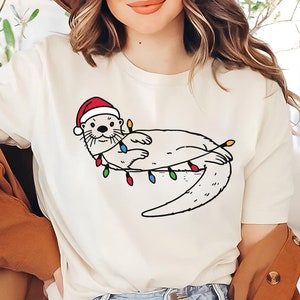 Christmas Otter Shirt | Otter Lover Tee | Cute Sea Animal Christmas T-Shirt | Otters Xmas Shirt | Holiday Otter Gift | Festive Otter Tee