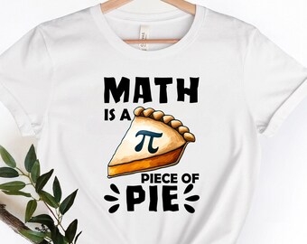 May include: White t-shirt with a black graphic that says "Math is a piece of pie" with a pie slice featuring the mathematical symbol for pi.