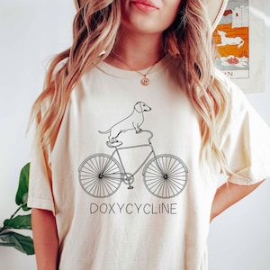 Doxycycline Pharmacy Pun T-Shirt | Dachshund on Bicycle | Pharmacists Shirt | Veterinary | Pharmacy Gift | Gift for Pharmacist & Technicians