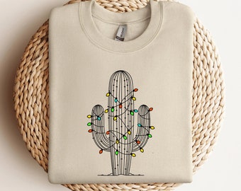 Holiday Cactus Crewneck Sweatshirt | Festive Desert Flair Tee | Cactus Christmas Lights | Cowboy Yuletide Sweatshirt | Southern Xmas Gifts