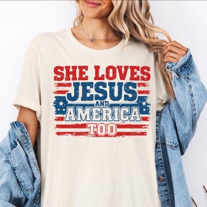 She Loves Jesus and America Shirt | Christian USA Flag Graphic Tee | Patriotic Faith Shirt for Women | 4th of July Jesus Lover T-Shirt