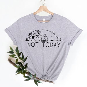 May include: Gray t-shirt with a black and white illustration of a bulldog sleeping and the text "NOT TODAY".