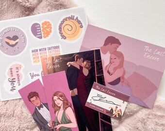 May include: A set of bookish goodies featuring a pink and purple color scheme. The set includes a book, bookmarks, stickers, and a signed bookplate. The book is titled "The Last Encore" and features a couple on the cover. The bookmarks feature the same couple from the book cover. The stickers feature various designs, including a brain, a swirl, and a heart with the text "Friends to lovers era".