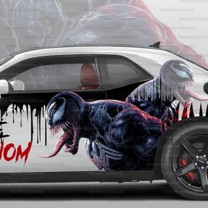May include: White car with a Venom-themed graphic design. The car features the words "WE ARE VENOM" in black and red, along with a large Venom illustration. The wheels are black with red brake calipers, and the text "BEAST MODE" is on the rear.