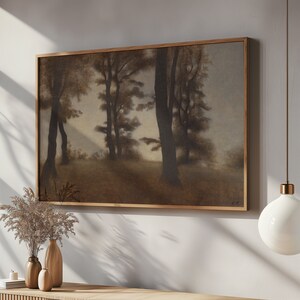 May include: A framed painting of a forest scene with tall trees in shades of brown and gray. The trees are silhouetted against a hazy background.