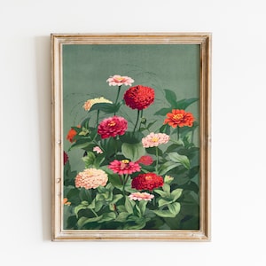 May include: Framed botanical print featuring a vibrant display of zinnias in shades of red, pink, orange, and cream against a muted green background. The flowers are surrounded by lush green foliage, all within a gold-toned wooden frame. A decorative floral artwork.
