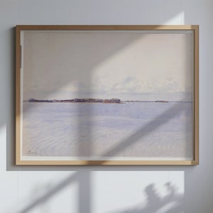 Puede incluir: Una pintura de paisaje en acuarela enmarcada. La obra representa una escena costera serena con un mar azul claro y una isla distante bajo un cielo nublado. La pintura está encerrada en un marco de madera de color claro.