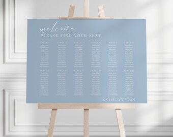 Pode incluir: Um cartão de lugar de casamento azul claro com o texto "welcome please find your seat" no topo. O gráfico lista as mesas de 1 a 12 com os nomes dos convidados abaixo de cada número de mesa. A parte inferior do gráfico diz "KATIE & DYLAN".