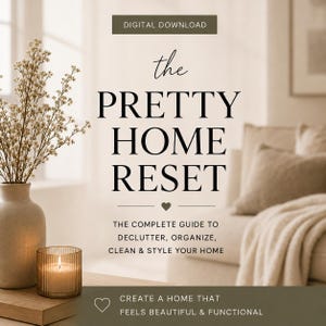 May include: A digital download guide titled The Pretty Home Reset, featuring the subtitle The Complete Guide to Declutter, Organize, Clean & Style Your Home, with a small heart icon and the text Create a Home That Feels Beautiful & Functional.