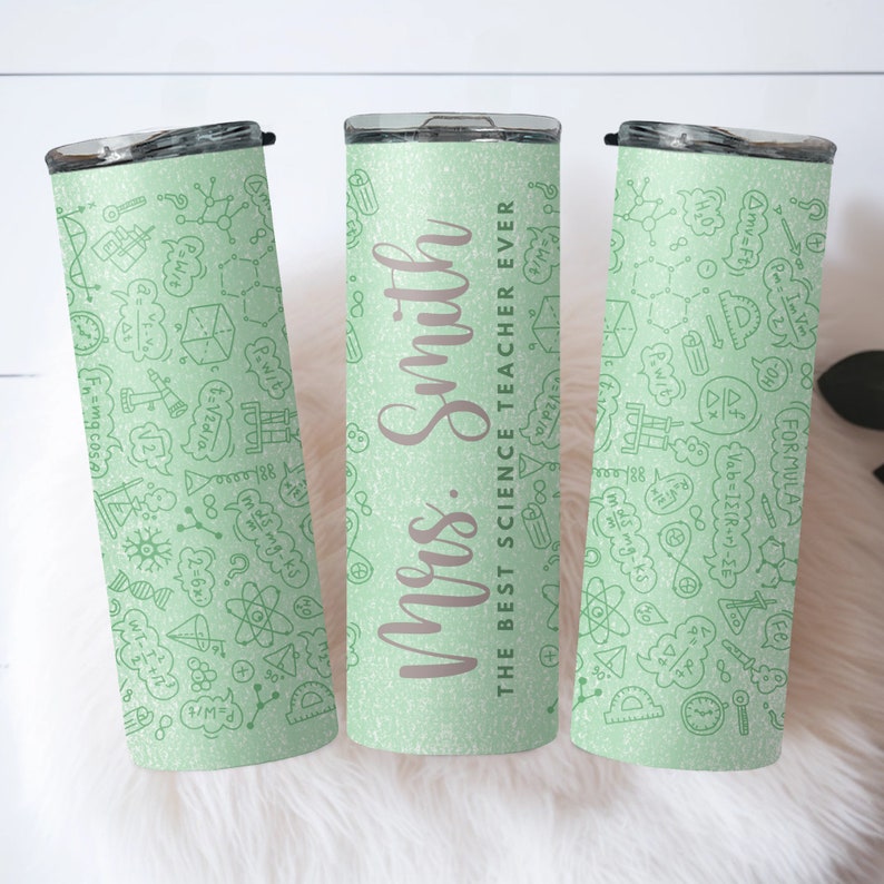 May include: Three light green insulated tumblers with a repeating pattern of science doodles and formulas. One tumbler has the text "Mrs. Smith" and "The Best Science Teacher Ever" in a script font.