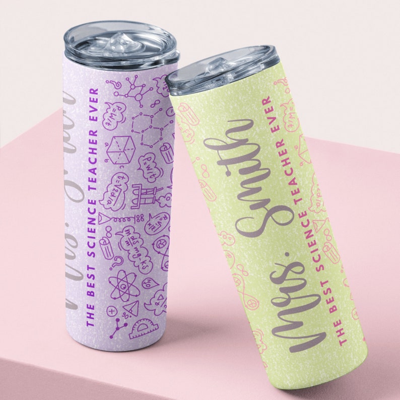 May include: Two stainless steel tumblers with lids. One is light purple with science-themed doodles and the text "THE BEST SCIENCE TEACHER EVER". The other is light green with the name "Mrs. Smith" and the same text.