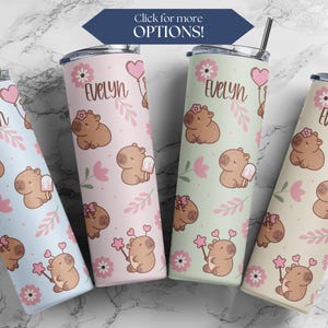 May include: Four stainless steel tumblers with a pastel pink, green, cream, and blue background. Each tumbler features a cartoon capybara with a popsicle, flowers, and the name "Evelyn".