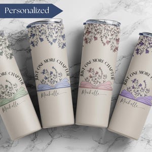 May include: Four stainless steel tumblers with a cream background and floral designs. Each tumbler has the text "Just One More Chapter" with a book and flowers. The tumblers are personalized with the name "Michelle".