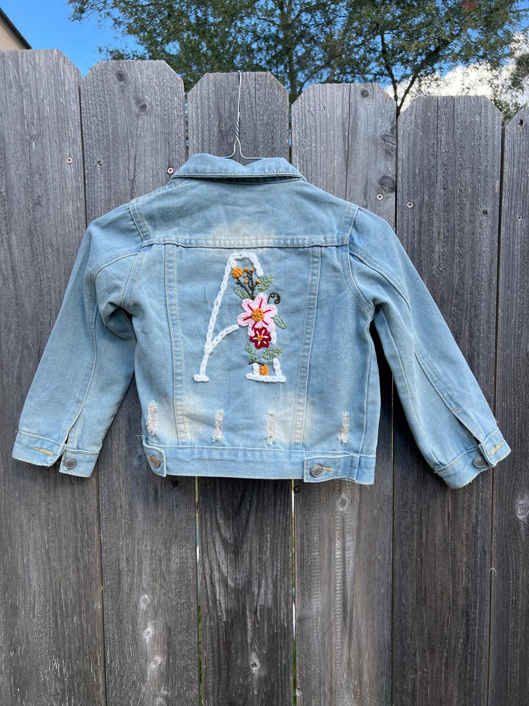 Denim jacket with embroidered logo