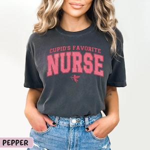 a woman wearing a black shirt that says cup's favorite nurse