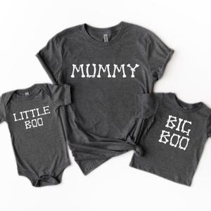 three gray t-shirts with white text, likely intended for a family or group of people.