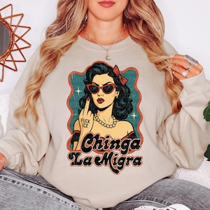 a woman wearing a sweatshirt with a picture of a woman on it
