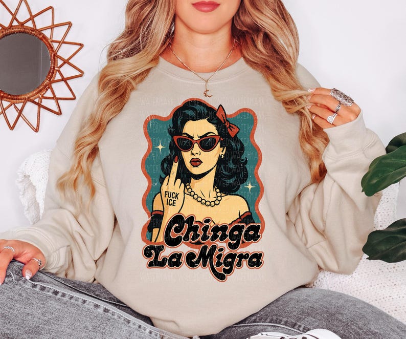 a woman wearing a sweatshirt with a picture of a woman on it