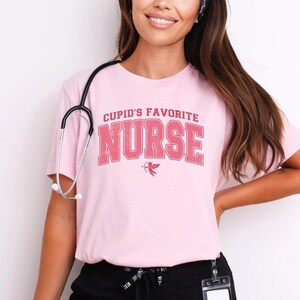 a woman with a stethoscope standing next to a wall