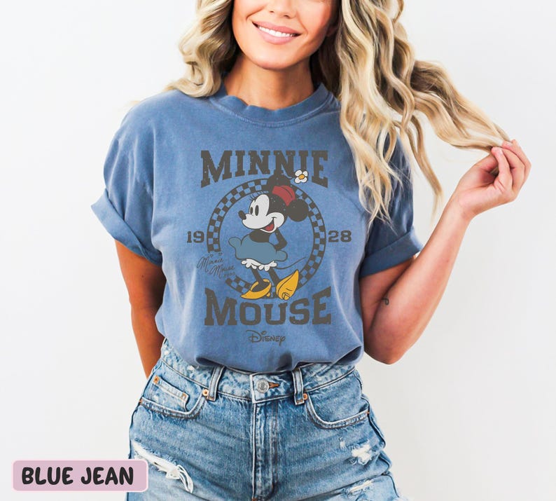 a woman wearing a minnie mouse t - shirt
