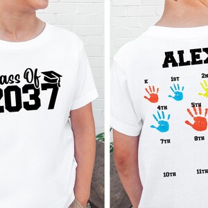 a young boy wearing a class of 2013 t - shirt